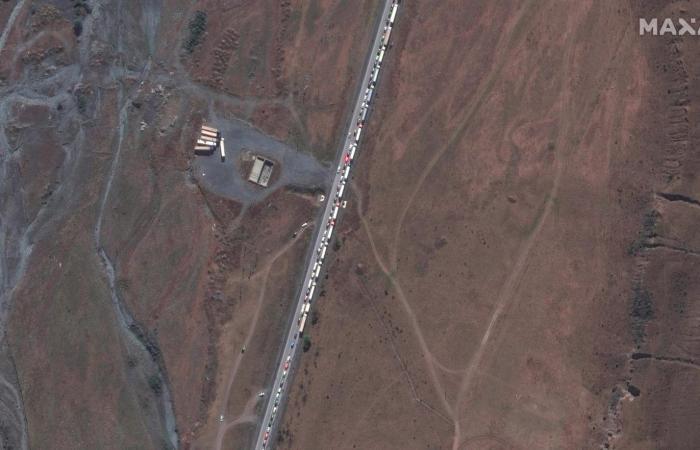 Satellite images show long queues of cars heading out of Russia